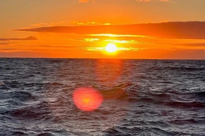 a sunset over a body of water