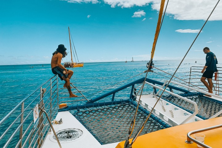 a man riding on the back of a boat